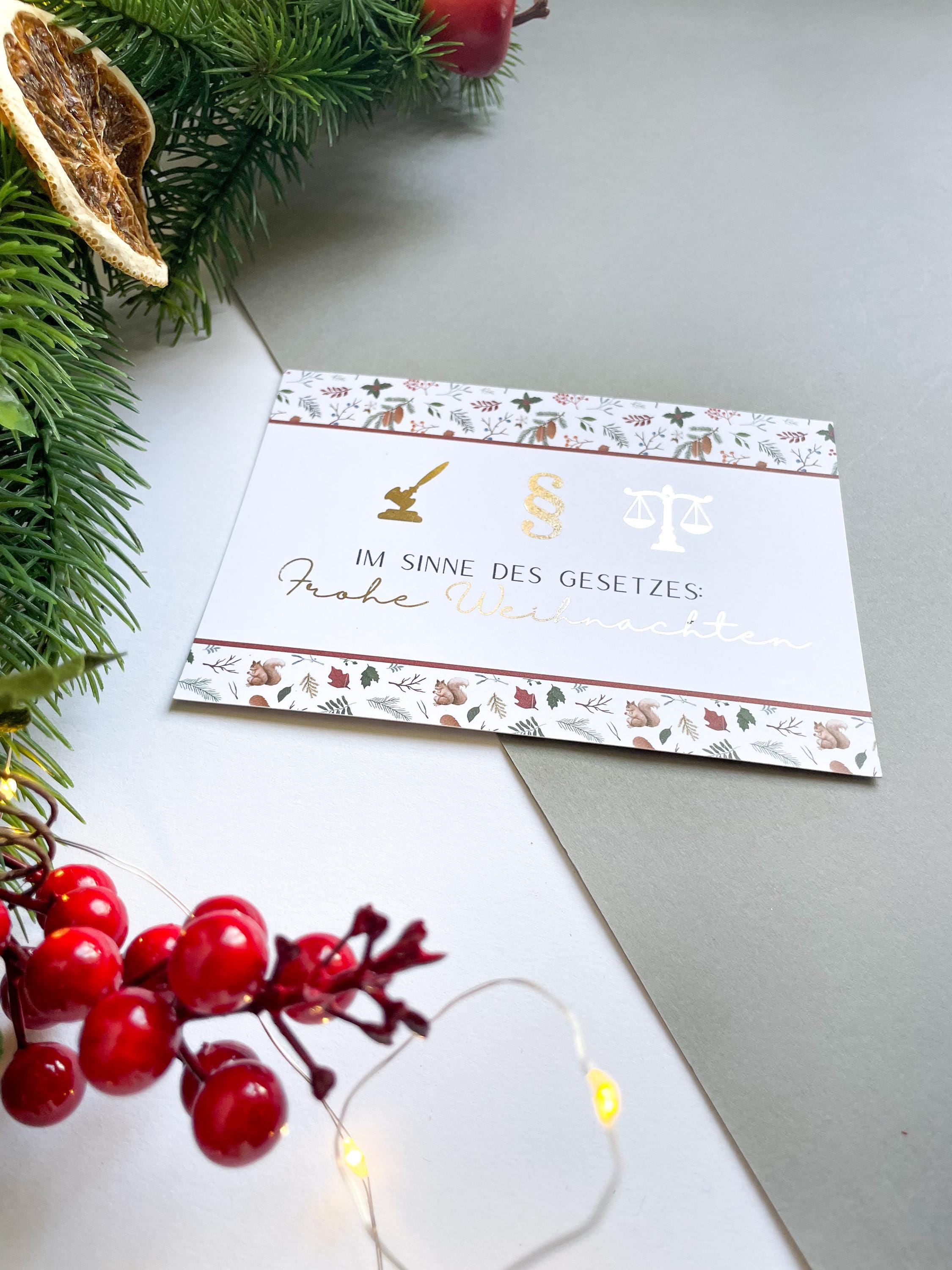 Christmas card – with legal symbols, paragraph sign, scales of justice, gift for jurists.